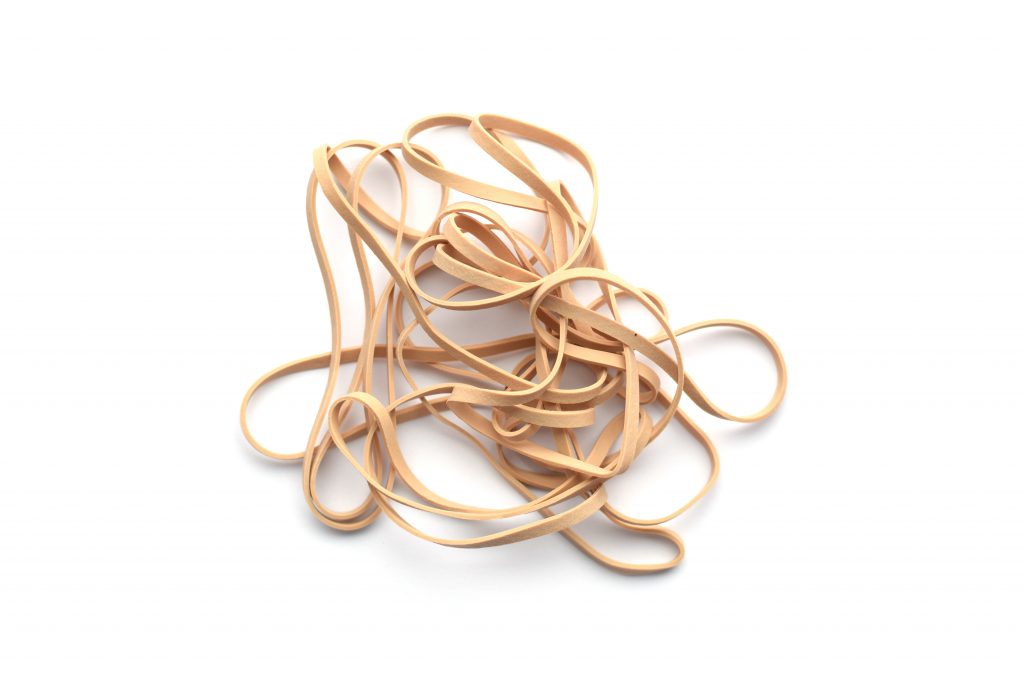 Pile of beige stretchy rubber bands