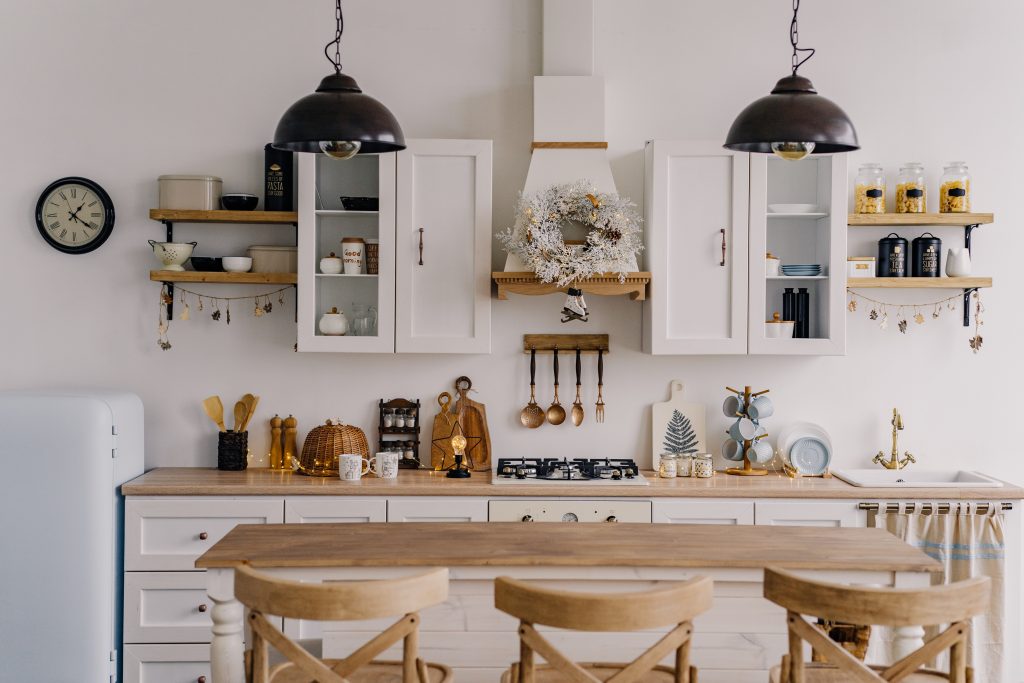 The interior of the bright kitchen with a bar in the Scandinavian style