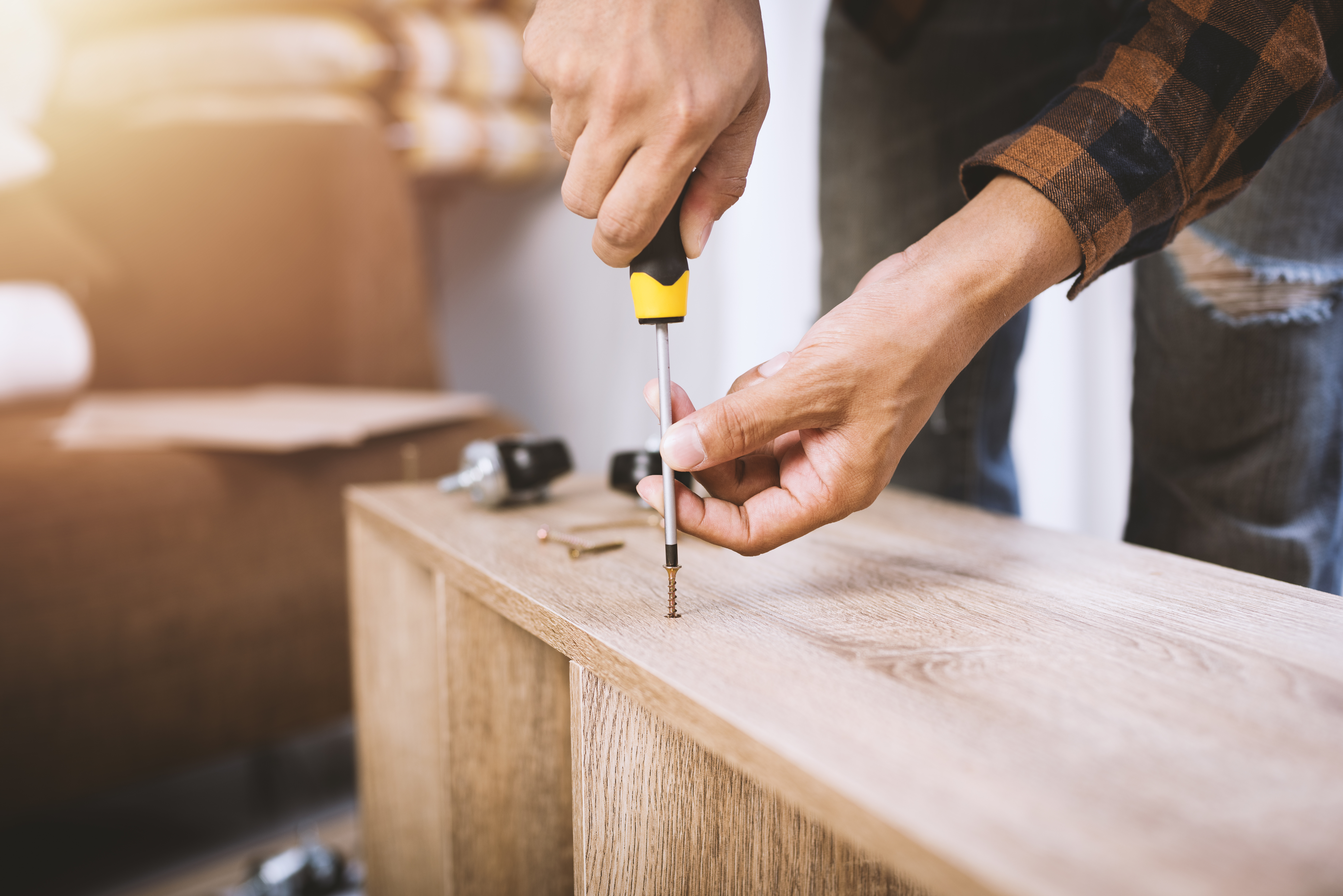 https://storables.com/wp-content/uploads/2020/05/man-assembling-a-shelf.jpeg