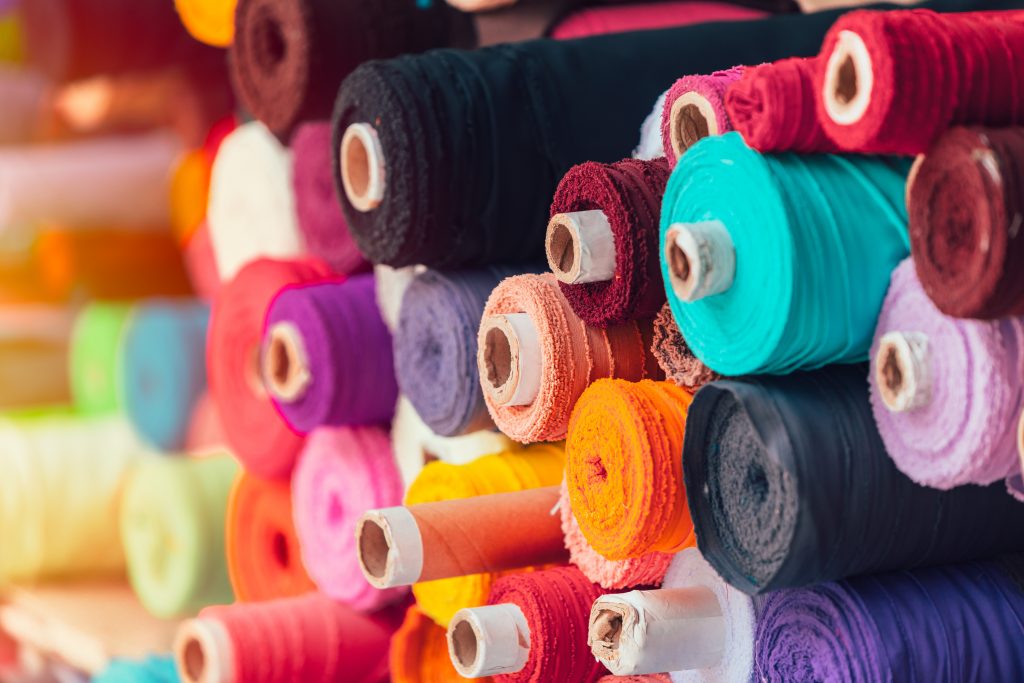 colorsful fabric silk rolls in textile shop industry from india