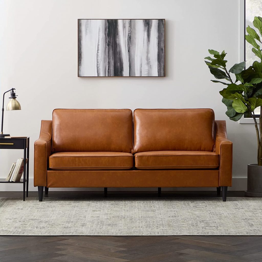 Edenbrook Transitional Faux Leather Sofa in camel faux leather color 