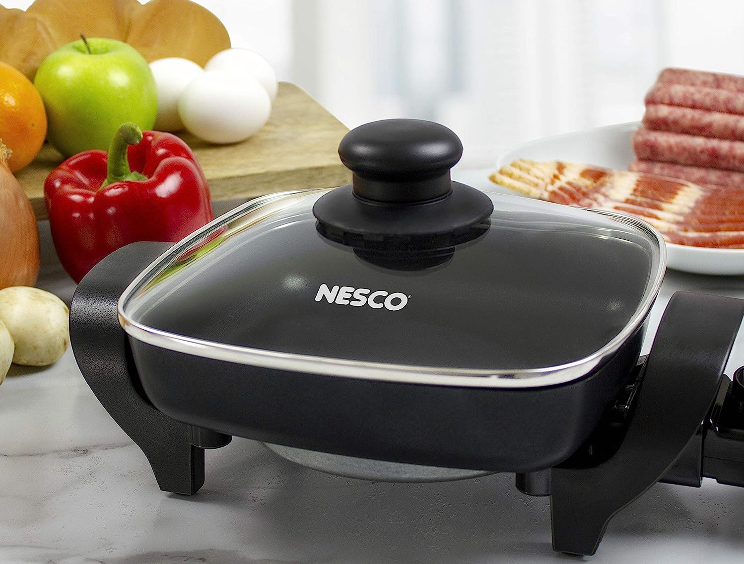 https://storables.com/wp-content/uploads/2023/07/nesco-extra-deep-electric-skillet-what-kind-of-non-stick-surface-safe-1690190479.jpg