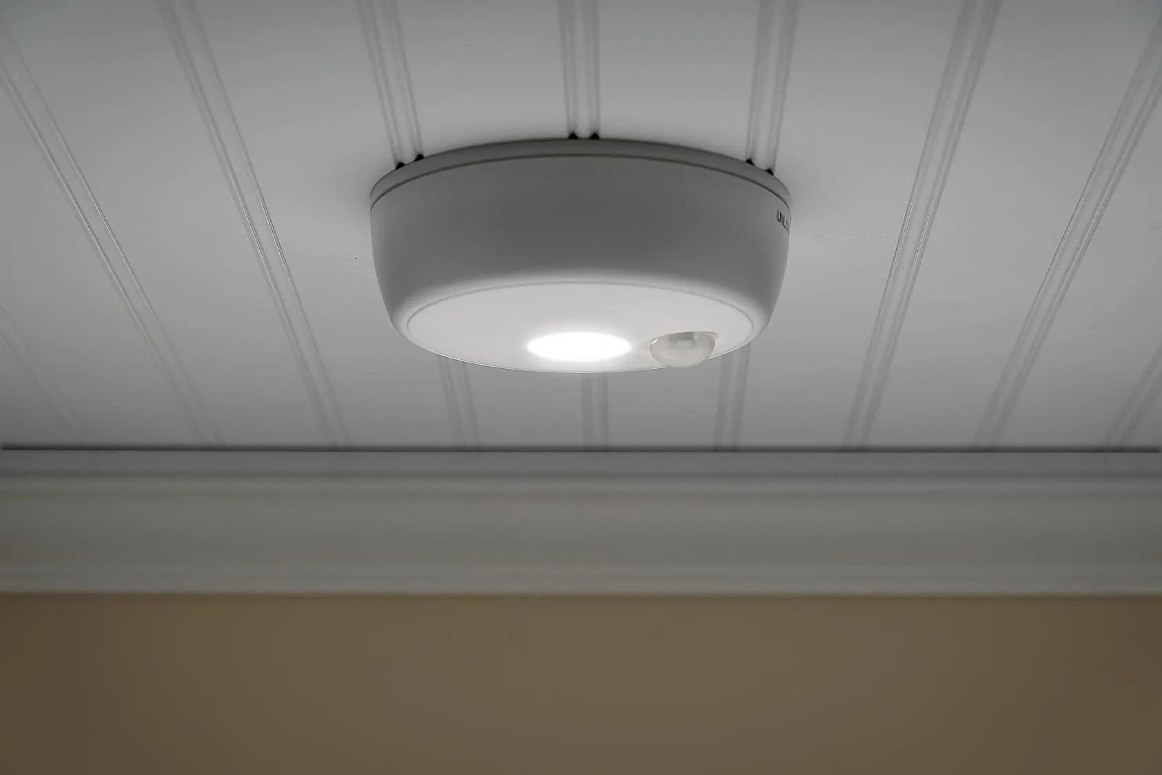 What Type Of Light Beam Does A Motion Detector Use, And How Does It Differ From A Laser