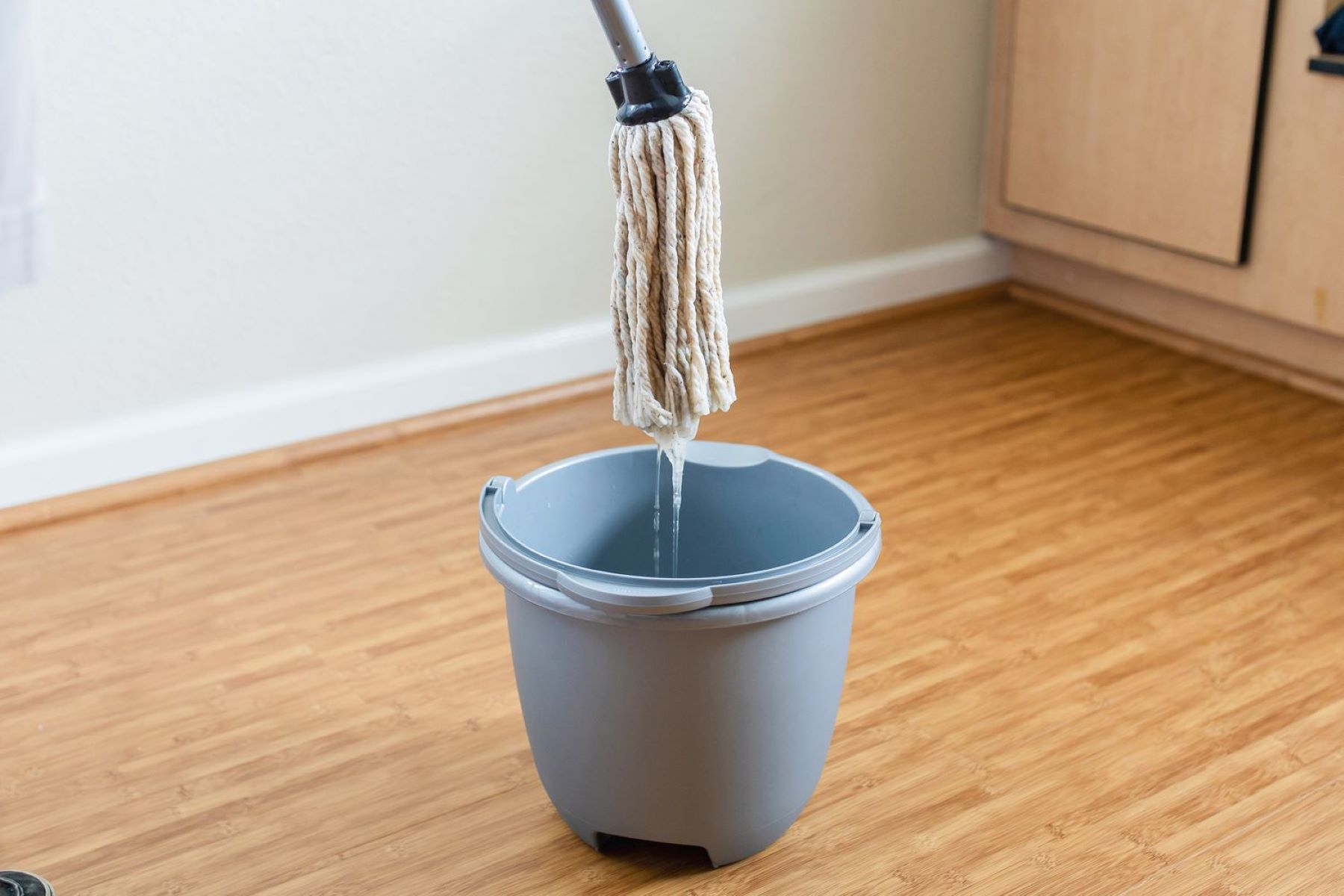 What Is The Correct Way To Handle A Bucket Of Dirty Mop Water?