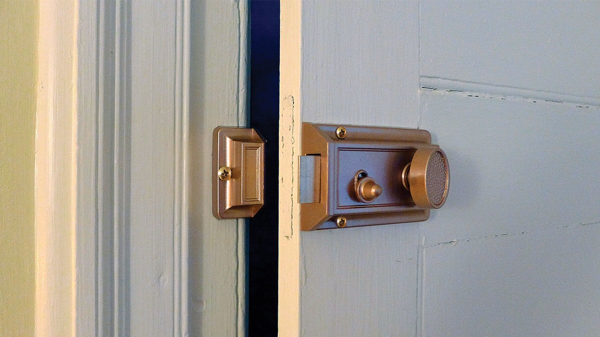 Which Type Of Lock Is Surface-Mounted On The Interior Of The Door Frame?