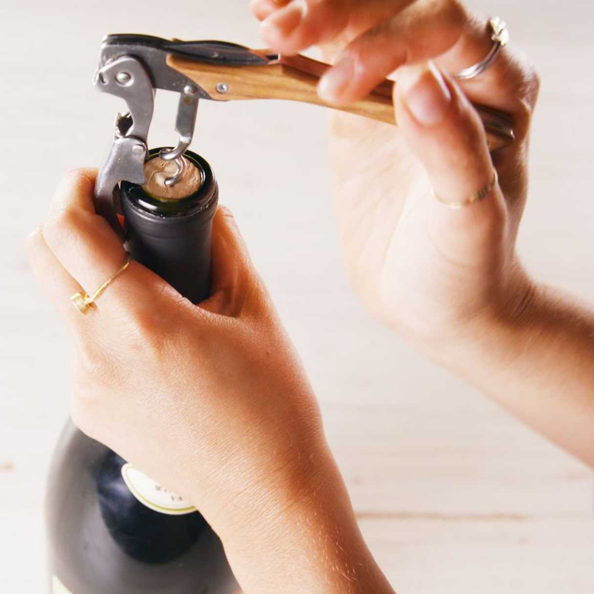 How To Use A Wine Opener With Arms