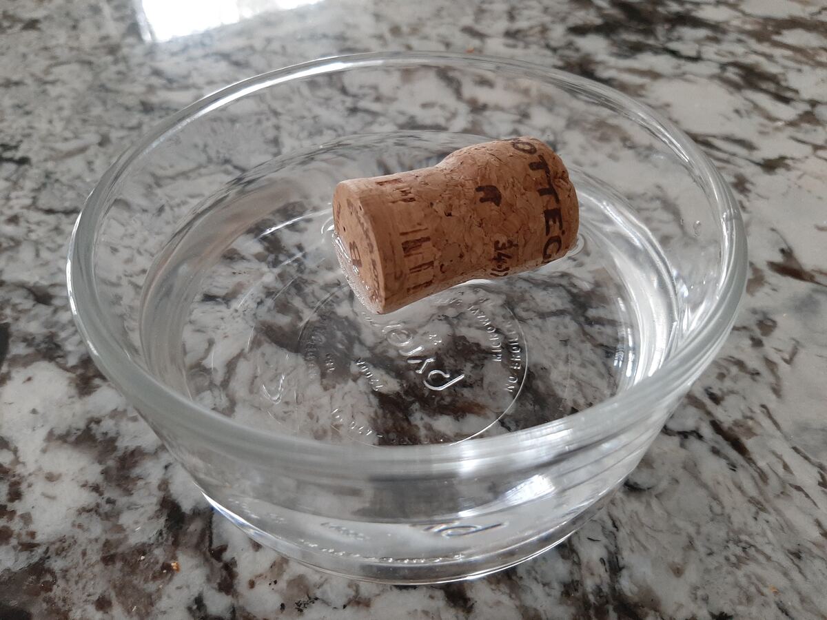 When A Cork Is Added To A Glass Of Water