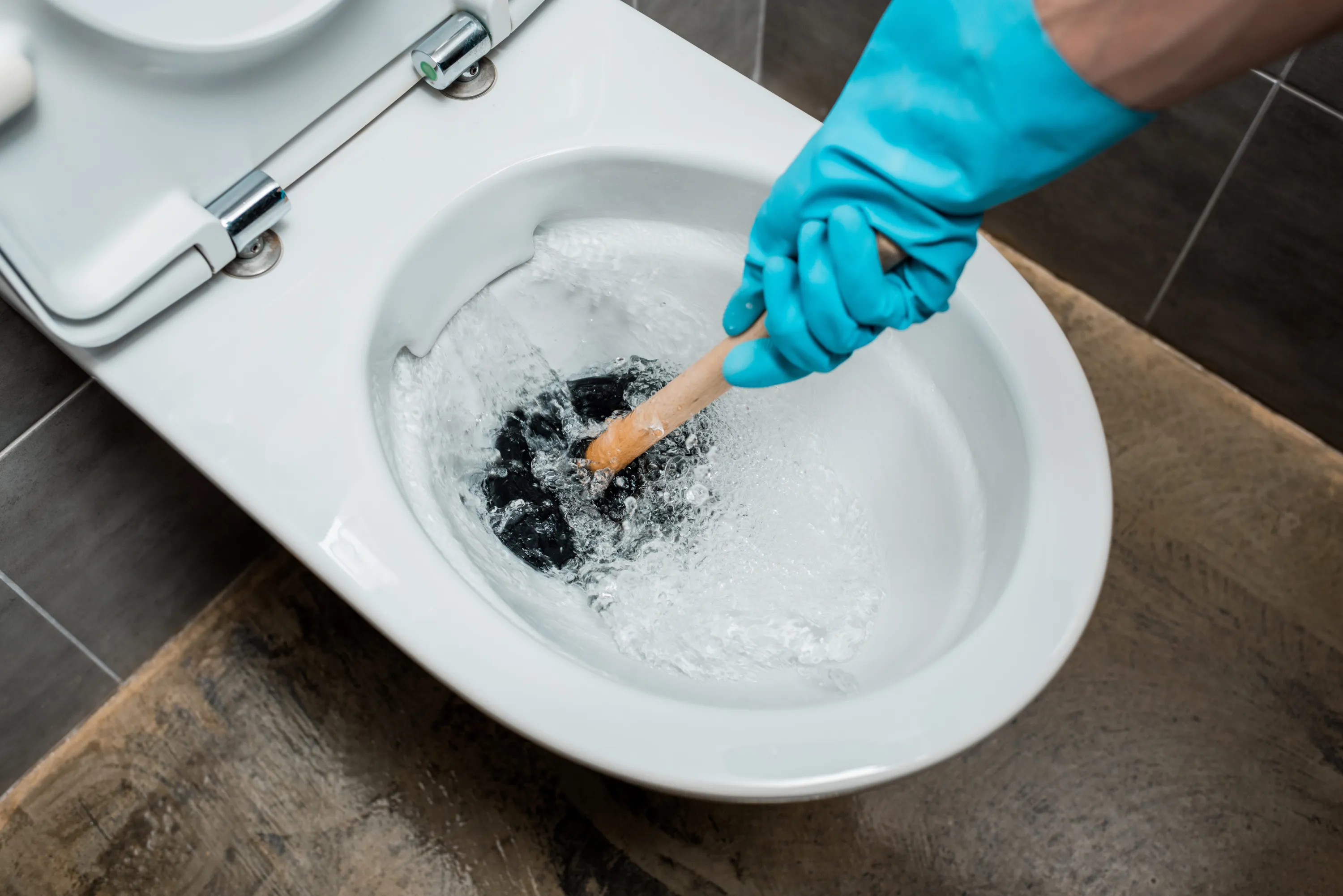 How To Clear A Clogged Toilet With A Plunger